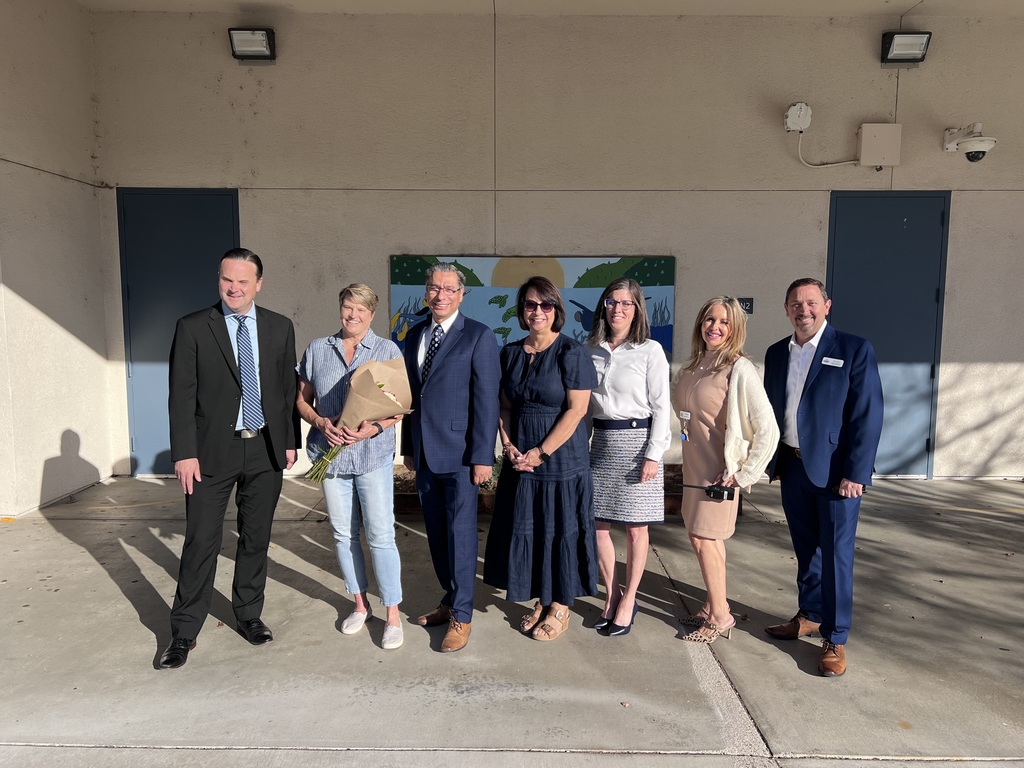 District teacher of the year, Rincon teacher, Amber Terry, standing with EUSD Cabinet members and Principal