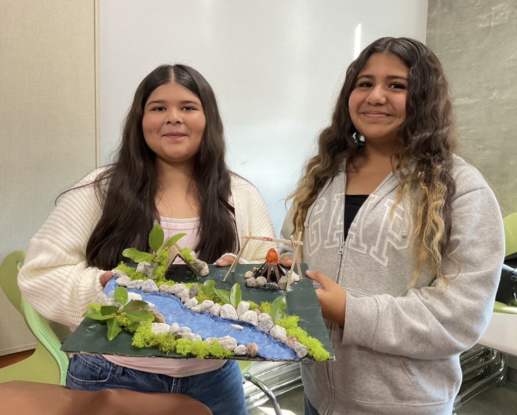 Students showing their 3d project for the social studies presentation. 