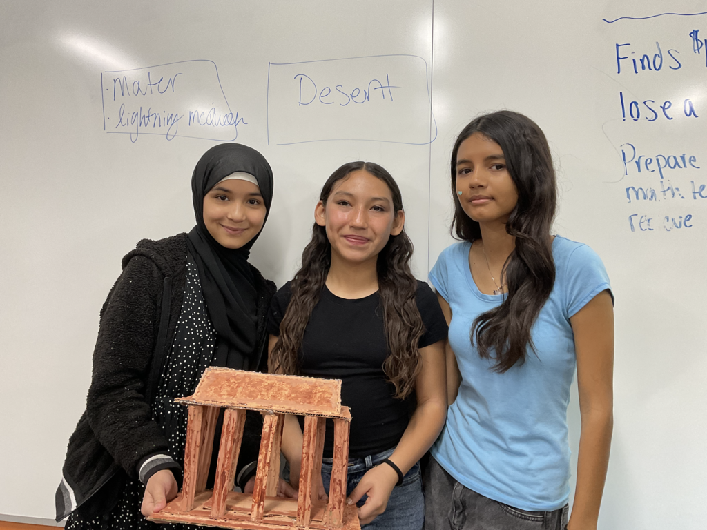 Students showing their 3d project for the social studies presentation. 