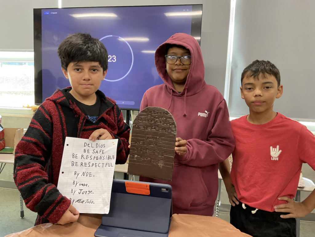 Students showing their 3d project for the social studies presentation. 