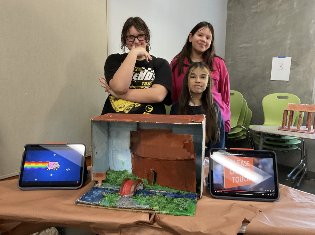Students showing their 3d project for the social studies presentation. 