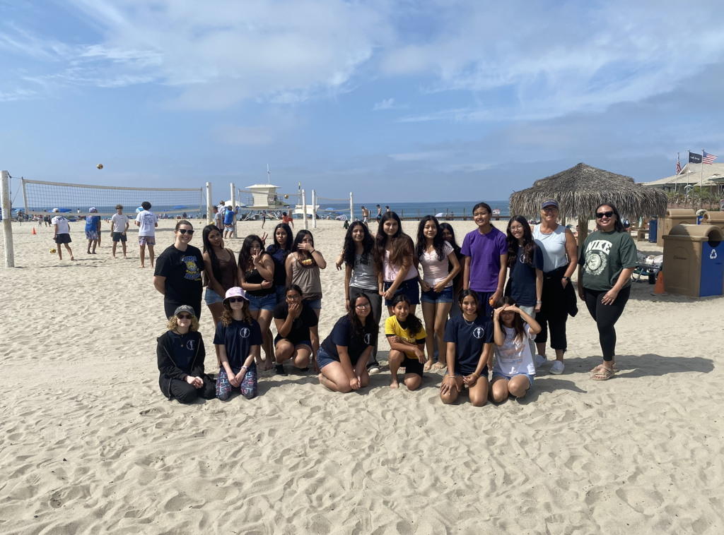 students on the beach at the beach clean up