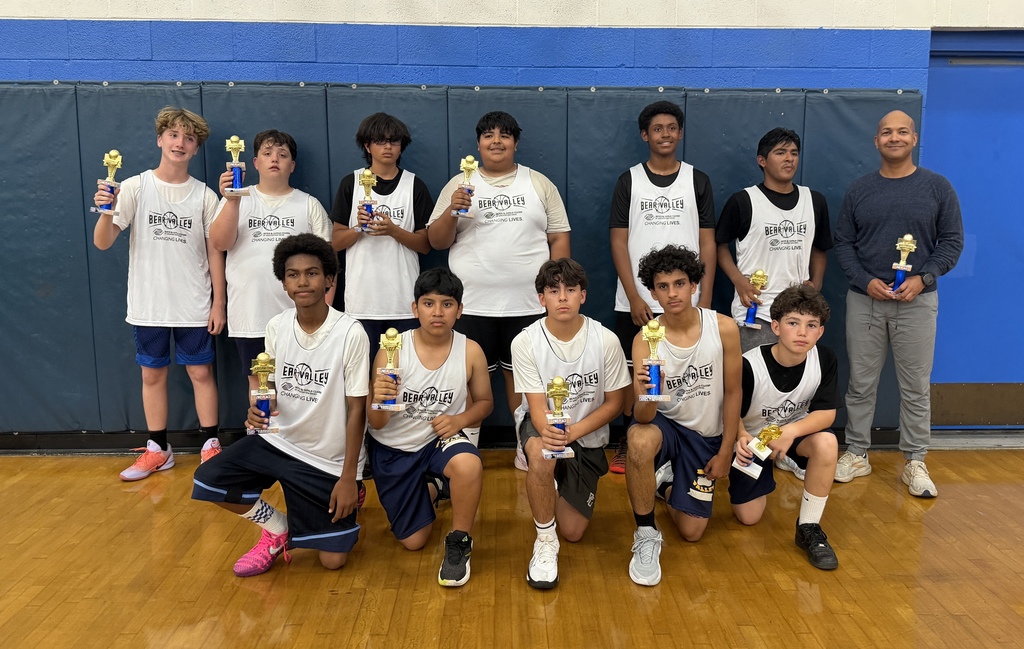 Students holding trophies