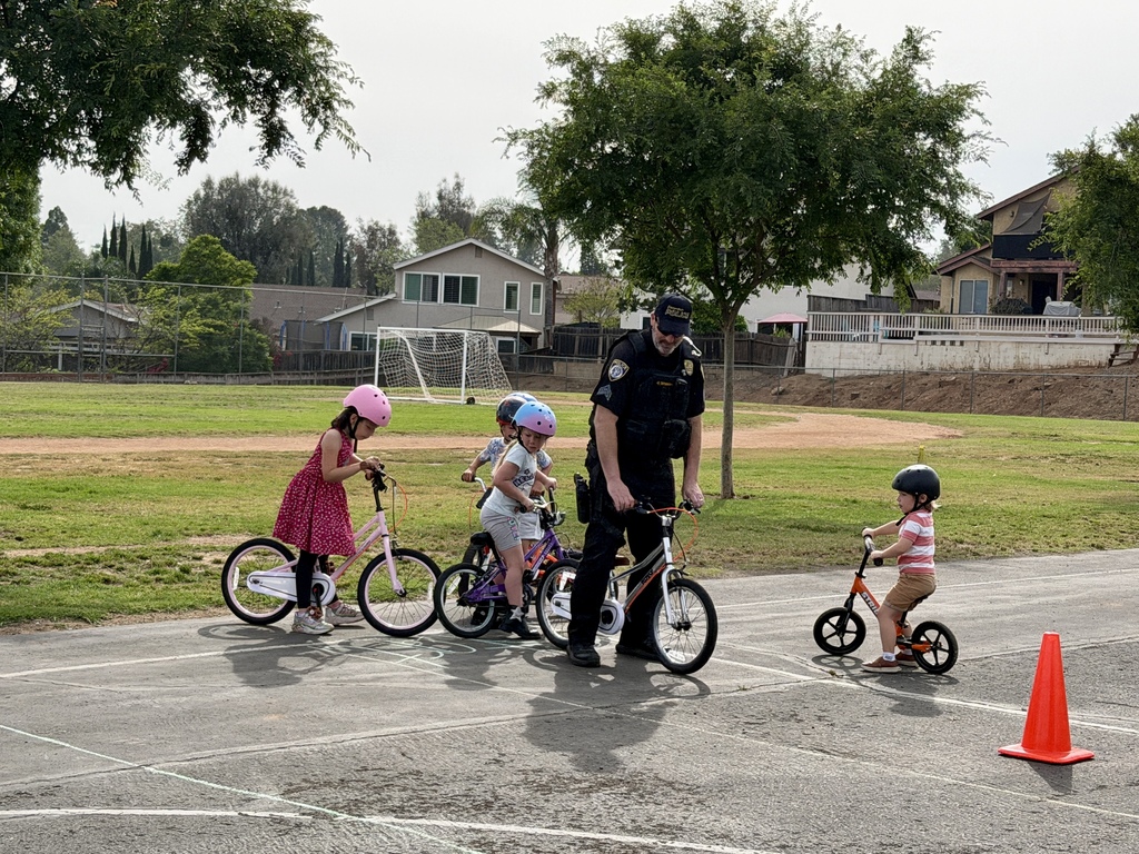 Police officer showing students on bike how to properly ride them