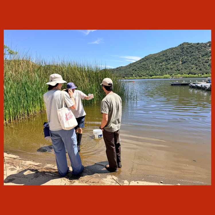 Mr. Zanesco and two officials from Lake Wohlford getting ready to release the trout into the lake