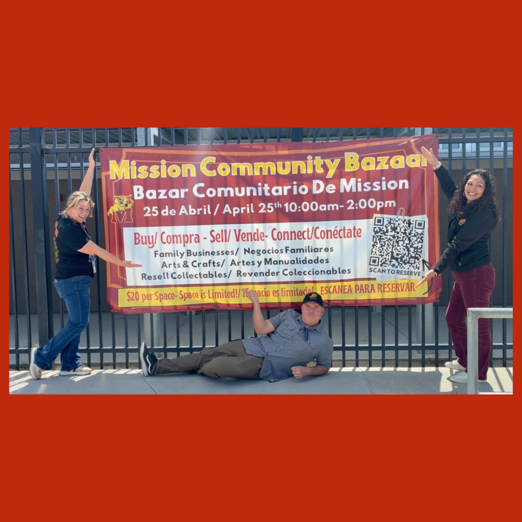 Principal Jason Hoff with Maribel Valle and Kimberly Palm flanking the banner for the Mission Community Bazaar