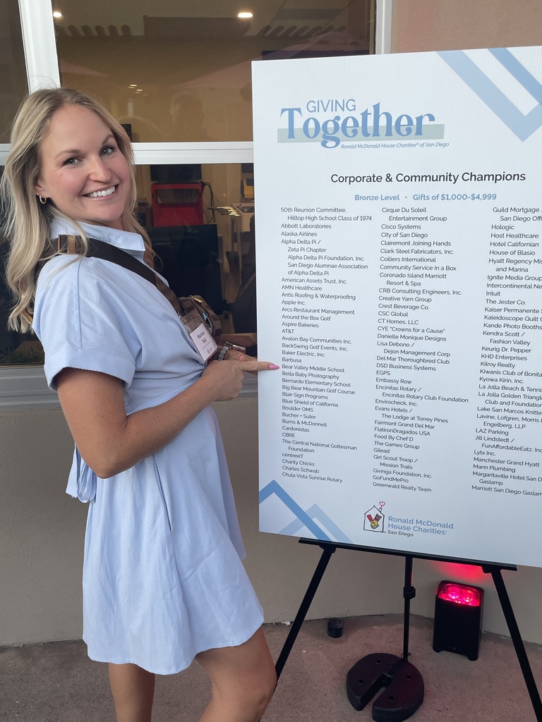 Individual pointing to BVMS on a poster