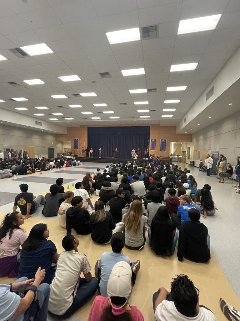 audience members watching stage