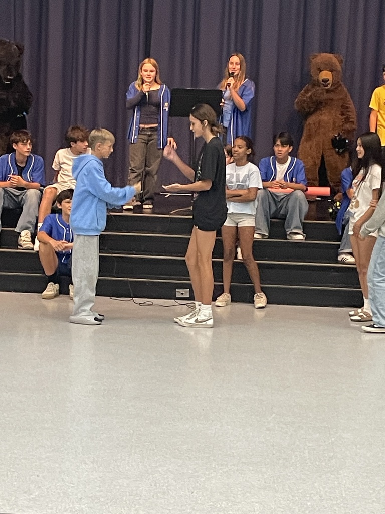 students doing rock paper scissors