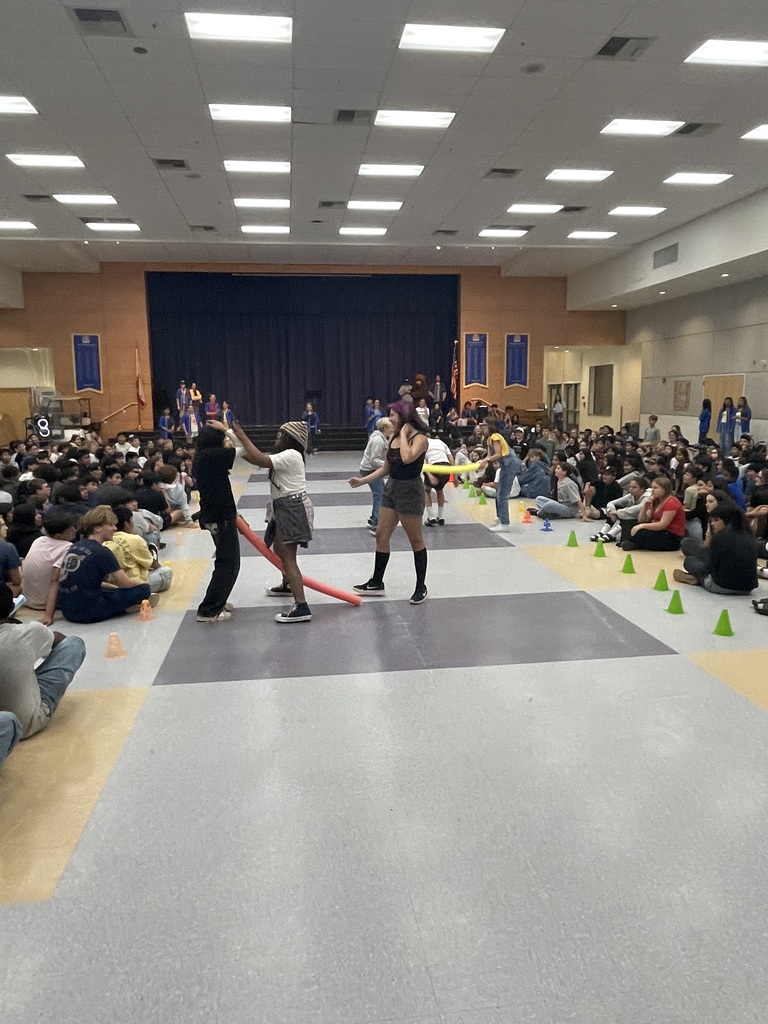 students taking part in a game in front of audience