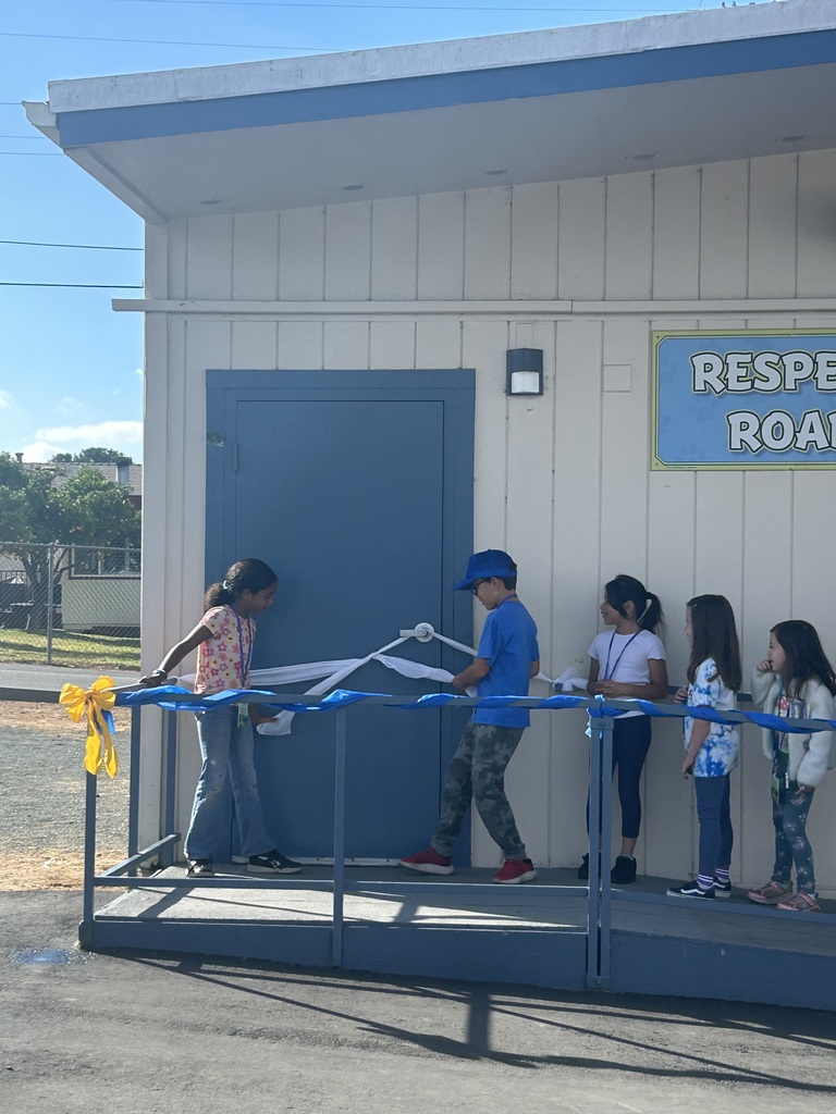 Students cutting the ribbon