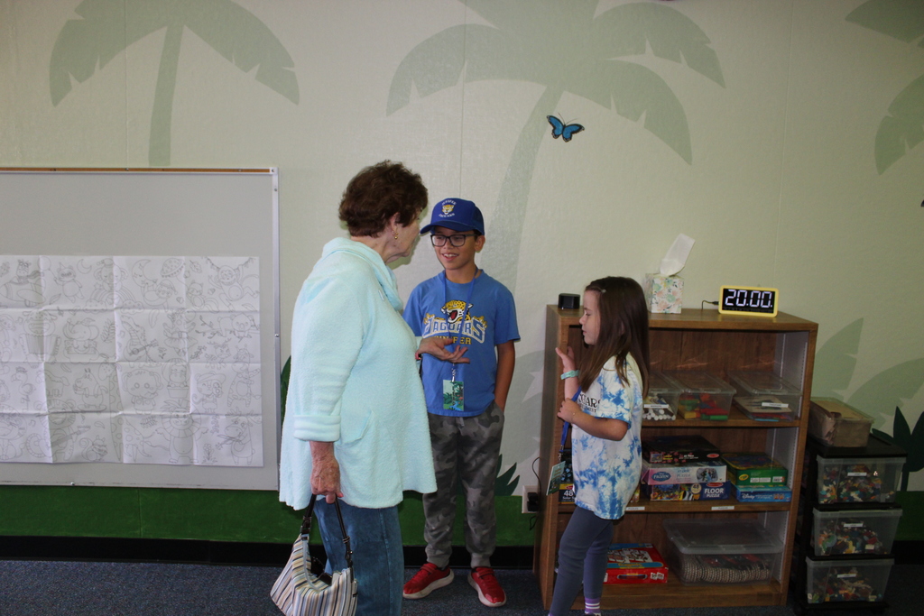 Students and community members viewing the retreat room