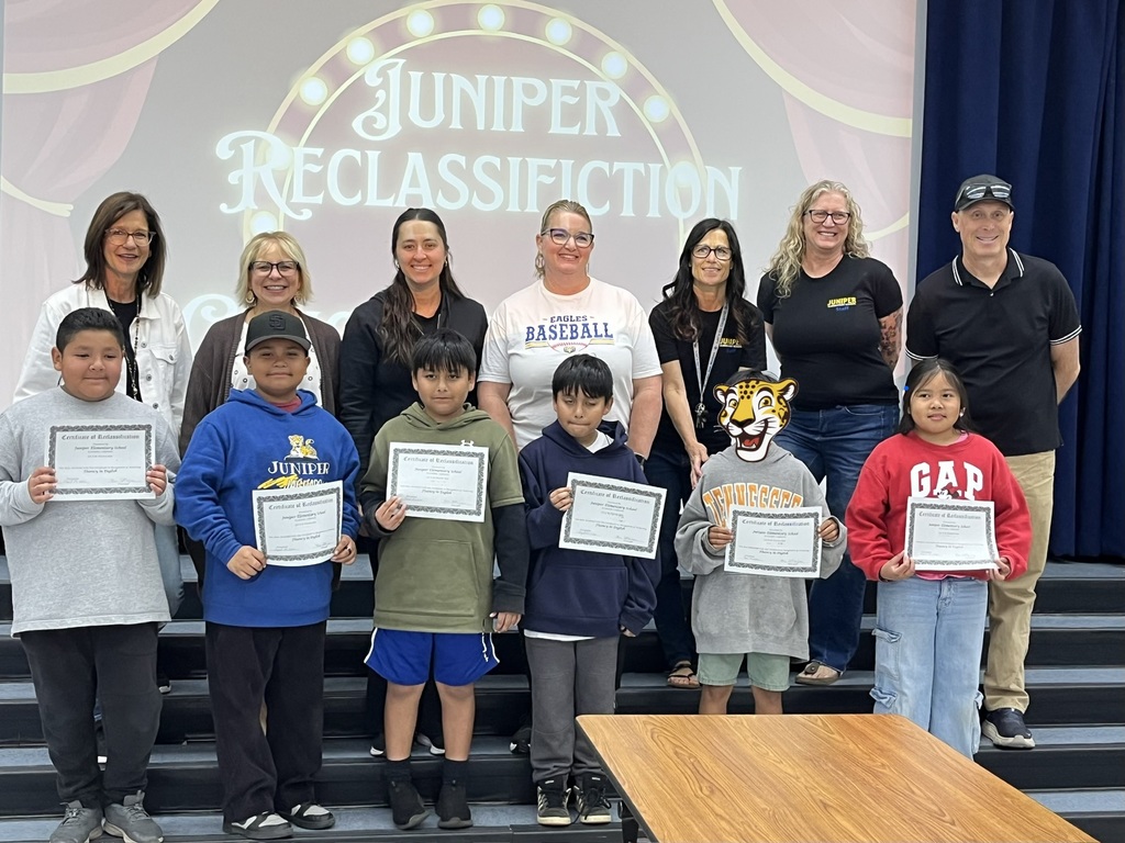 Reclassified students and their teachers posing.