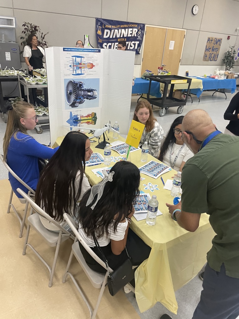 Scientsit presenting to students