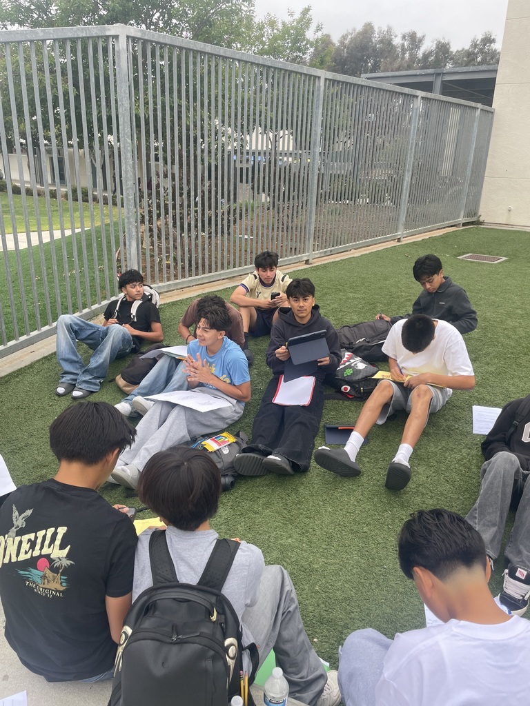 Group of boys working on school work