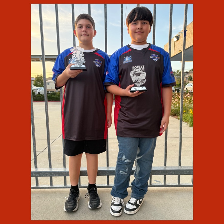 Kaleb and Esteban holding their 2nd Place trophies