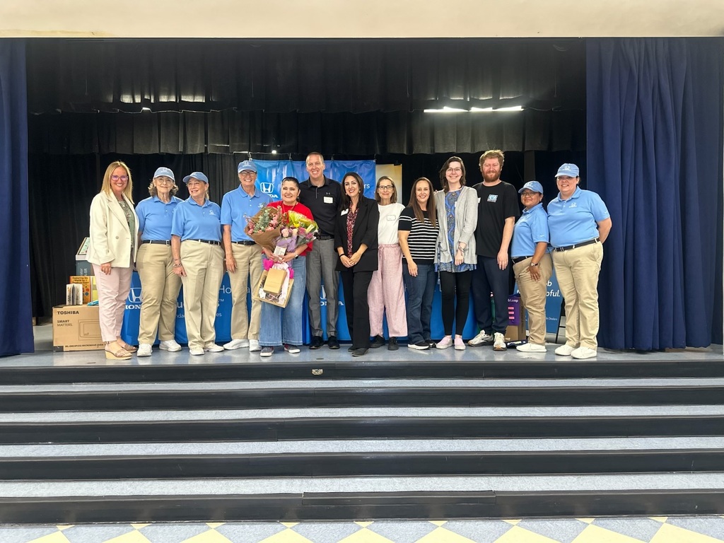 Staff and Honda Helpers recognizing a staff member