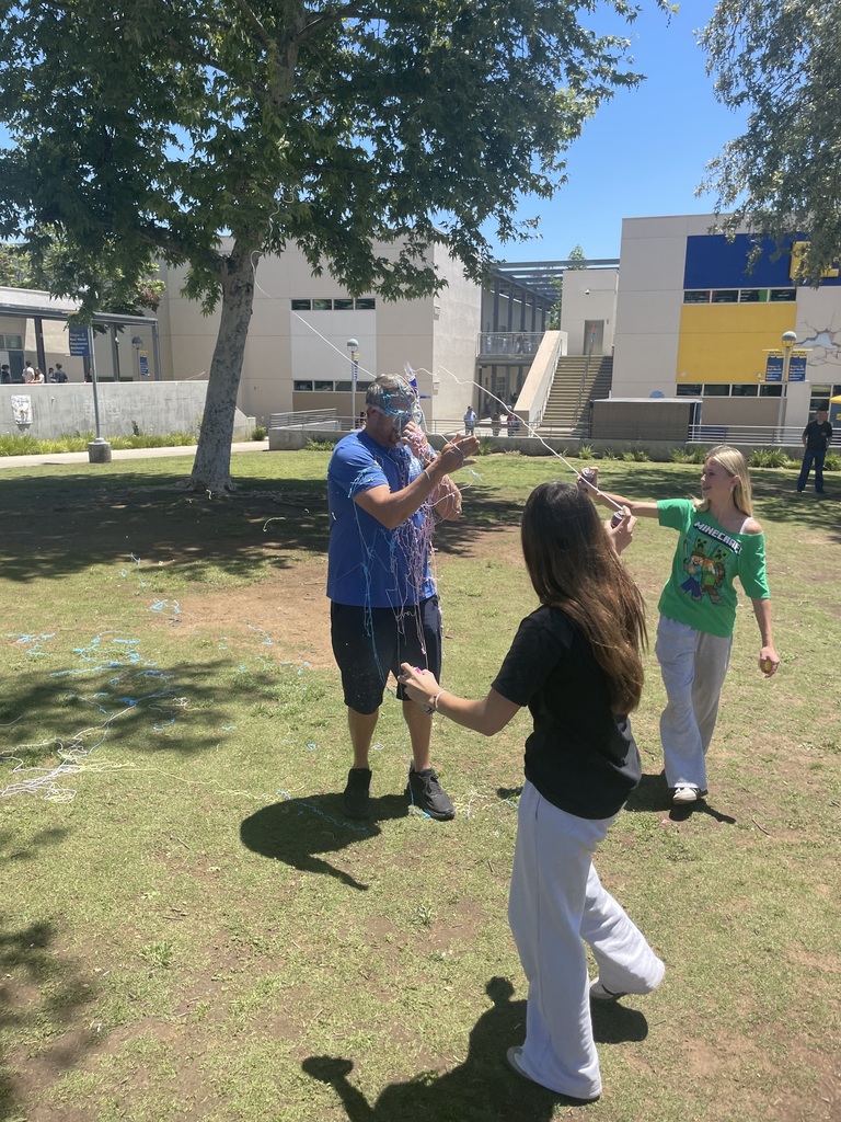 Teacher being silly stringed by students