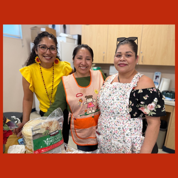A group photo of our Family Liaison, Maribel Valle, with two of our Mission parents who prepared lunch for the teachers and staff