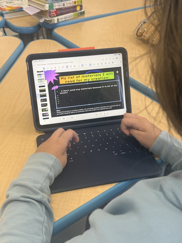 student typing on ipad