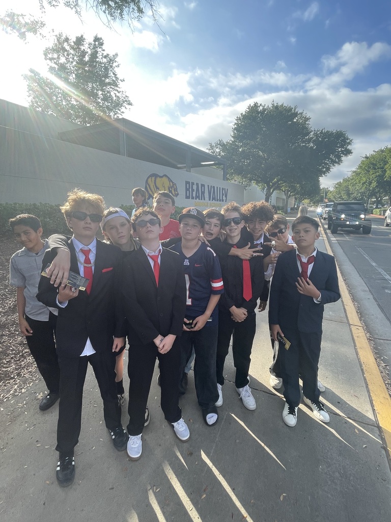 Group of students dressed up waiting to get into the dance