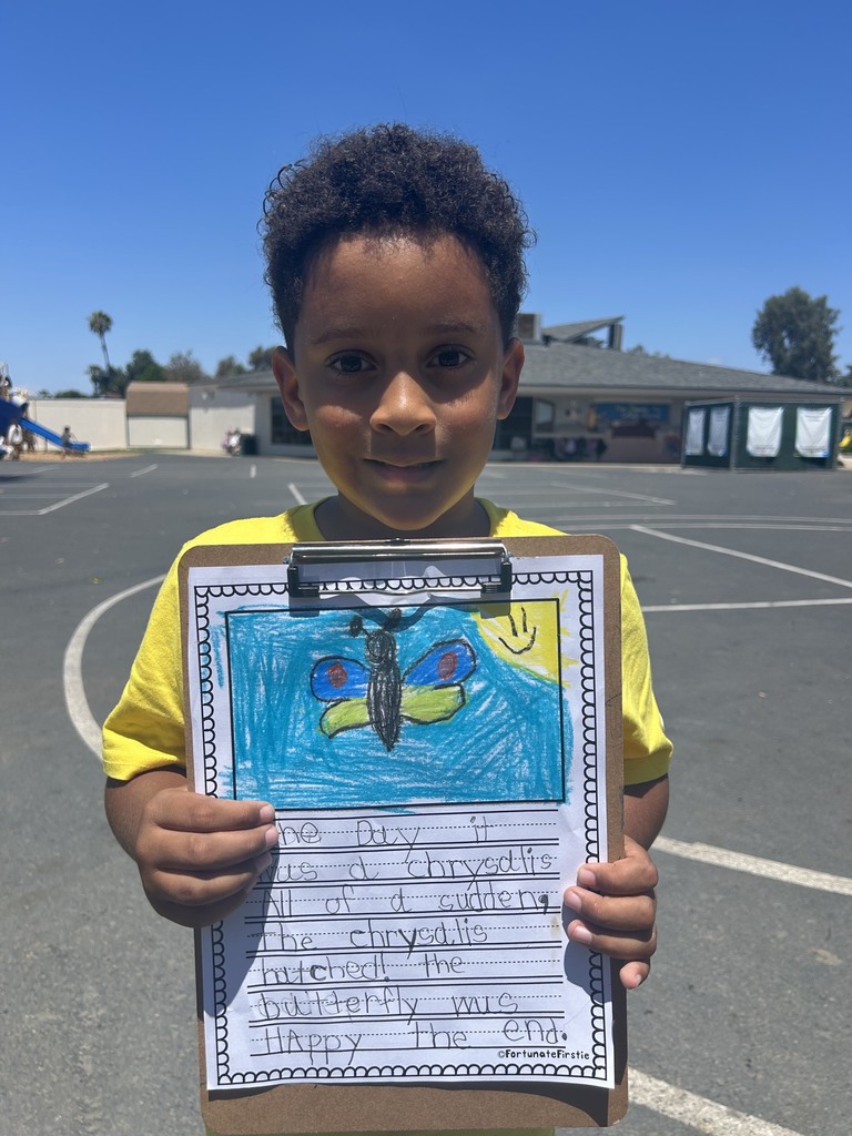 Student showing off his work