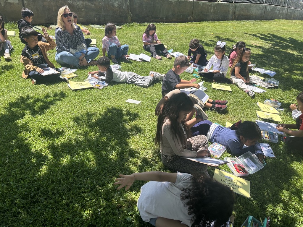 Kindergarten class writing outside