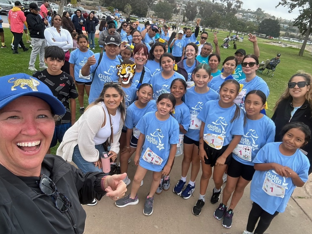 Girls on the run with staff and the student's families