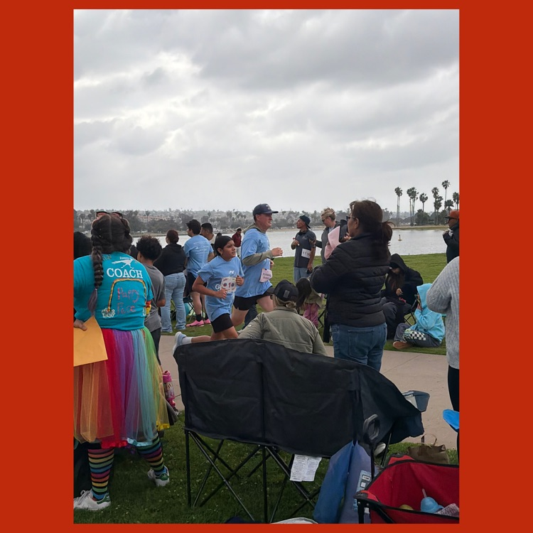 Mr. Zanesco running with one of Mission's Heart & Sole Running Team