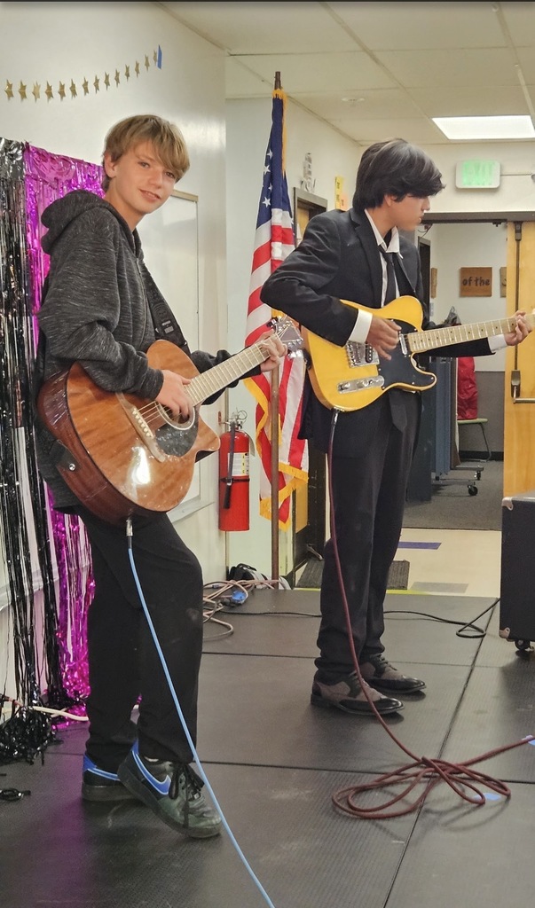 boys playing guitar 