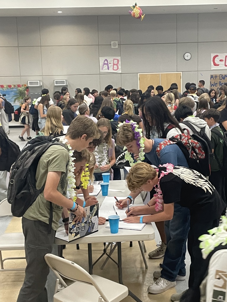 Students signing yearbooks