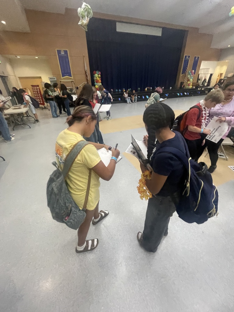 Students signing yearbooks