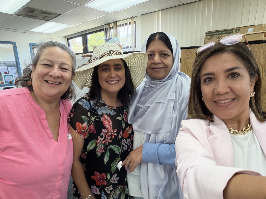 In image IMG_2708.jpg, four smiling women pose together indoors for a close-up selfie group photo