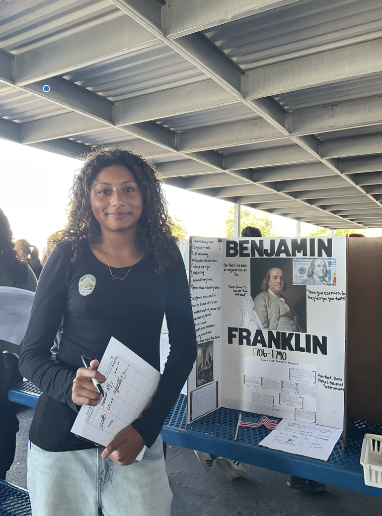 Student presenting at the Americans on Display event. 