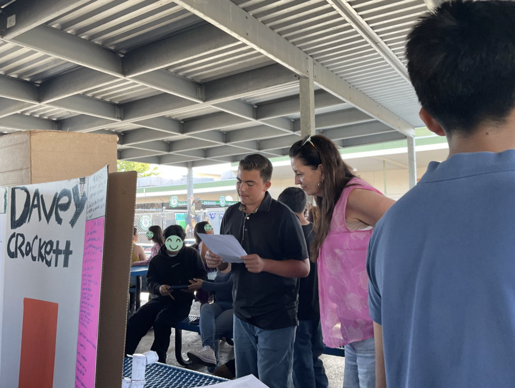 Student presenting at the Americans on Display event. 