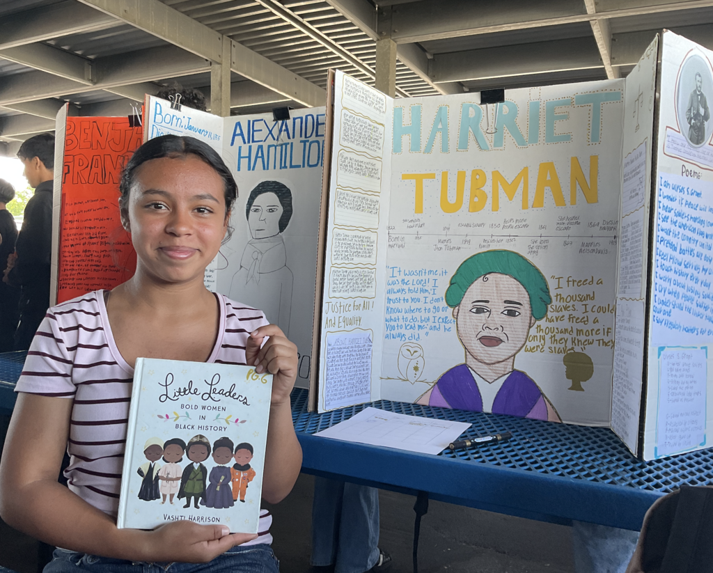 Student presenting at the Americans on Display event. 