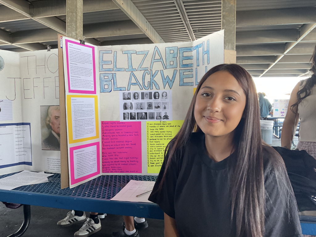 Student presenting at the Americans on Display event. 