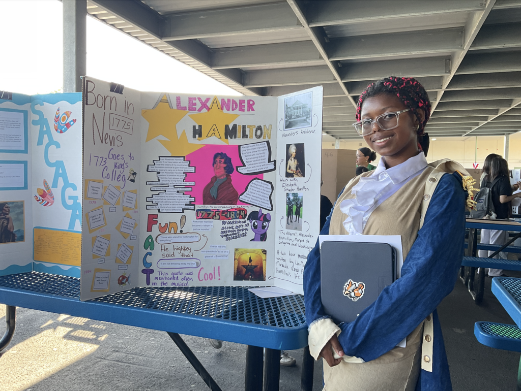 Student presenting at the Americans on Display event. 