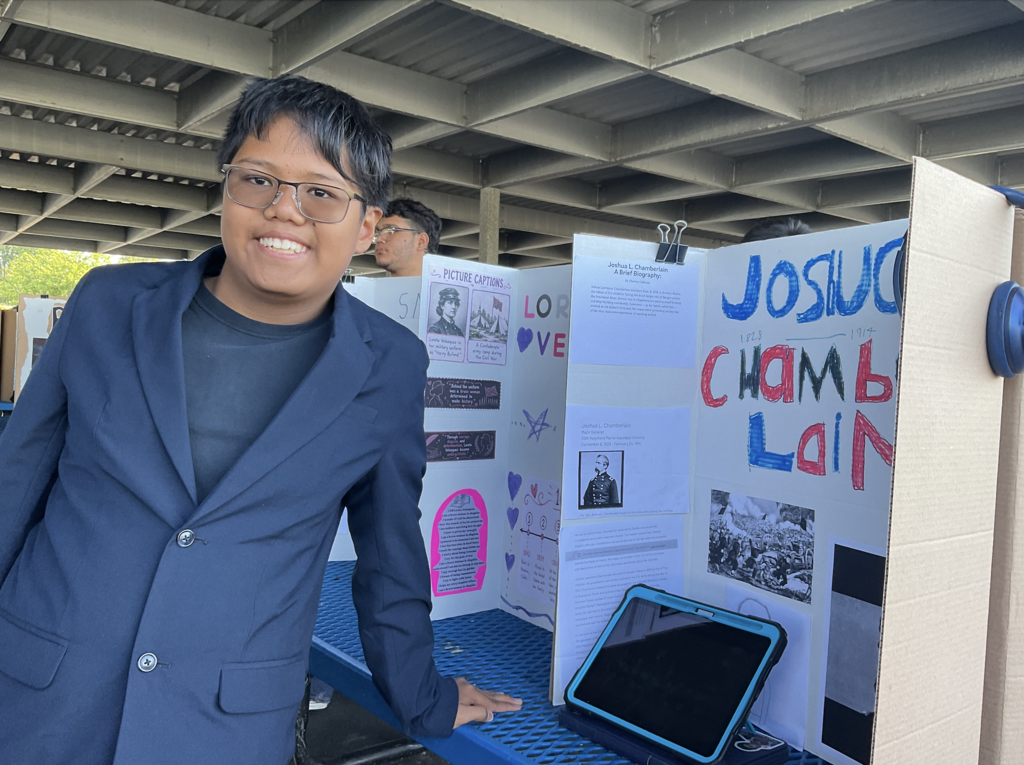 Student presenting at the Americans on Display event. 