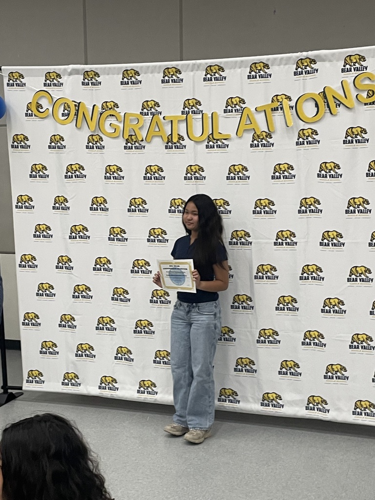 Student holding an award