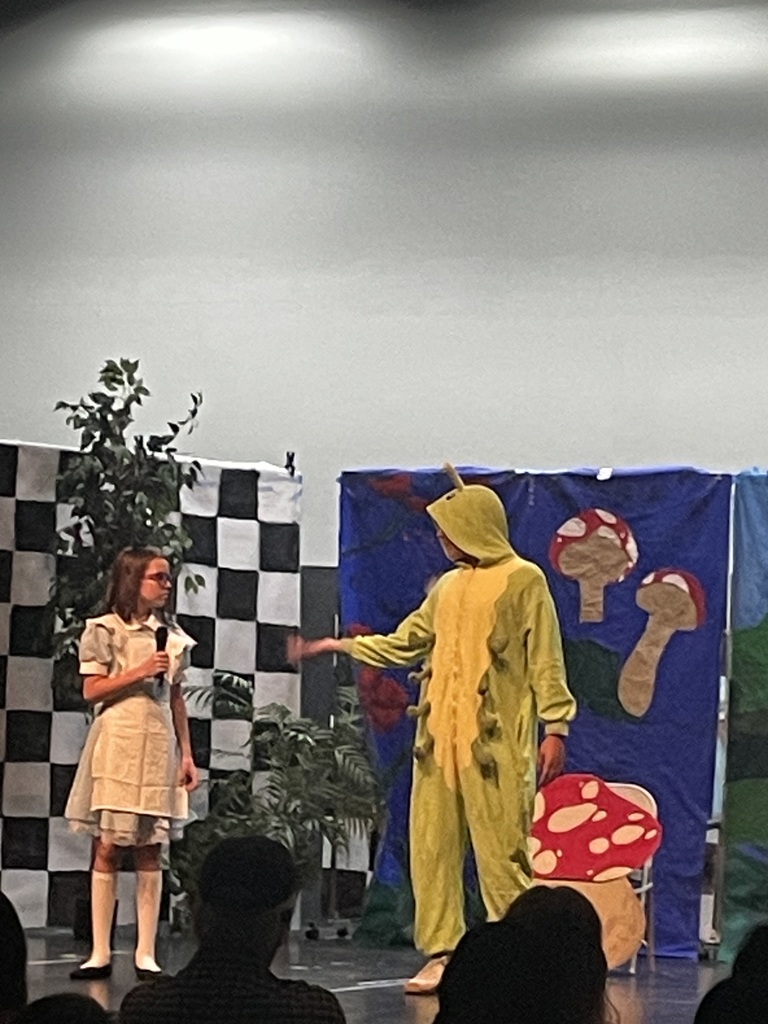 Students performing on stage