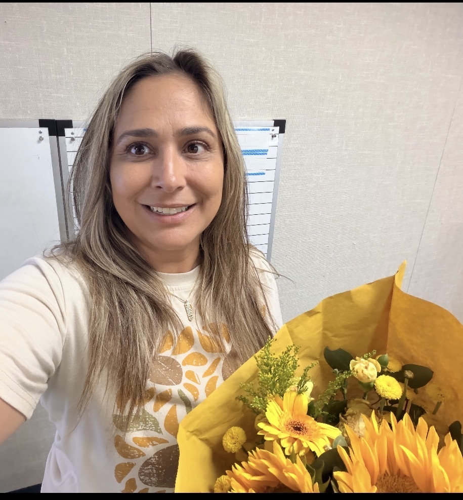 Ms. Soto holding flowers