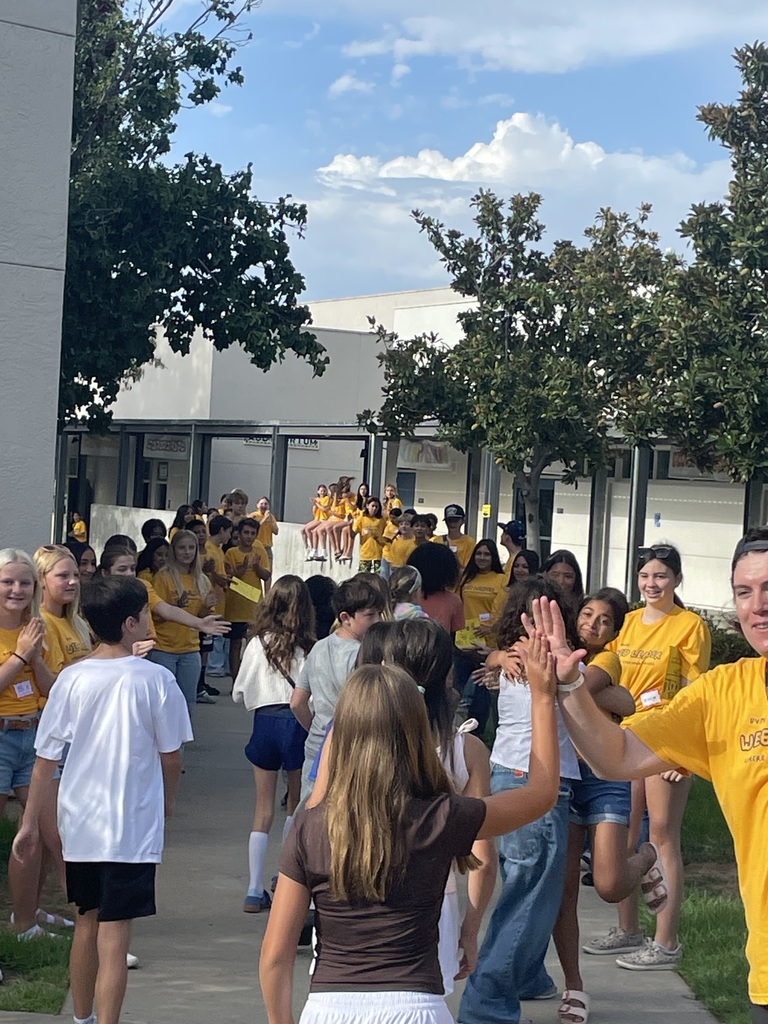 students being greeted by WEB leaders