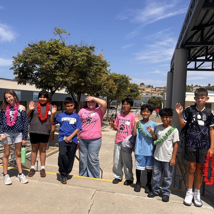 students waving 