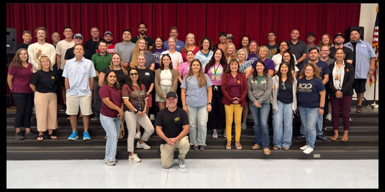 A serious group photo panorama of Mission's faculty and staff