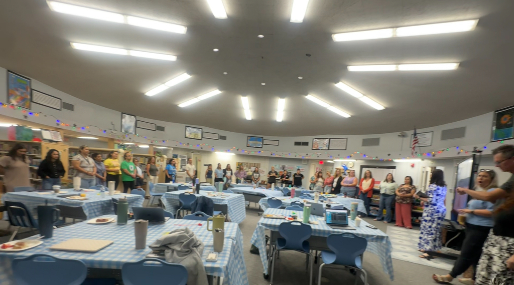 Conway Staff in a circle in the school library