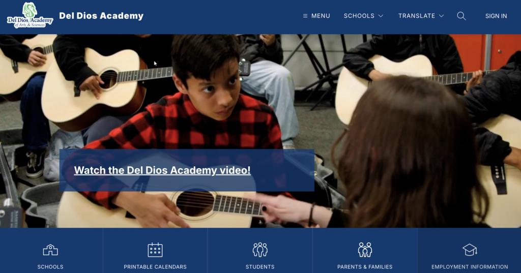 Home page of the Del Dios Academy website. Home page shows an image of a student learning to play the guitar. Tabs include schedules, printable calendars, students, parents and families, and employment information. Menu, Schools, Translate, and Sign In are labeled on the top right of the website.