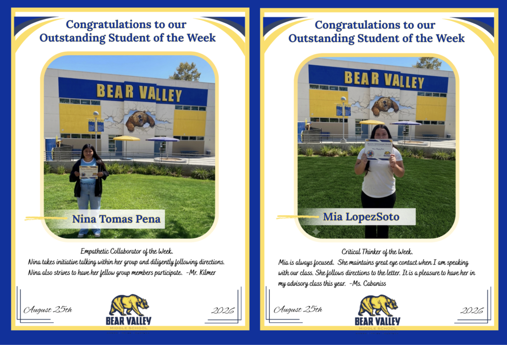 Picture of two students holding their awards