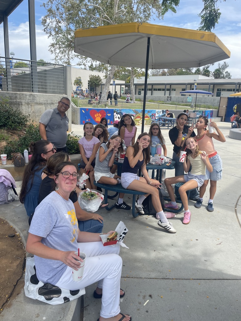 students eating with their families