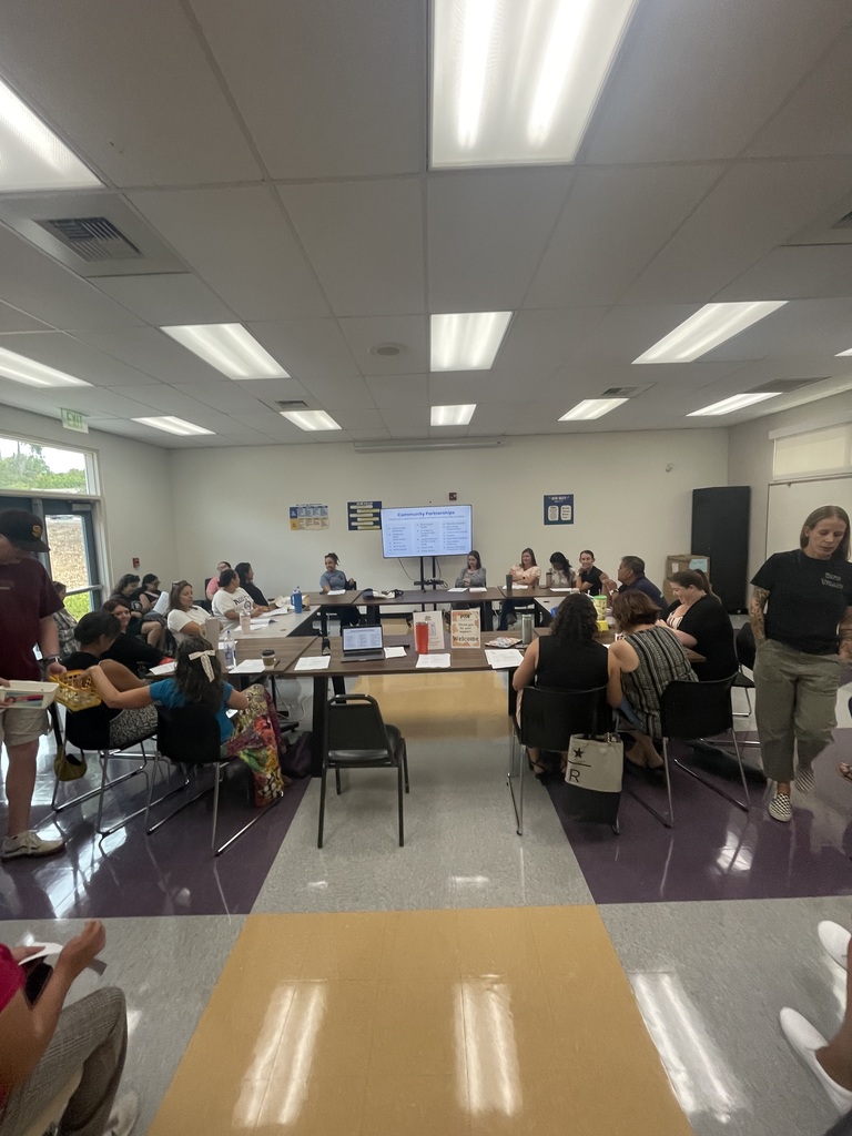 students serving coffee at a PTA meeting